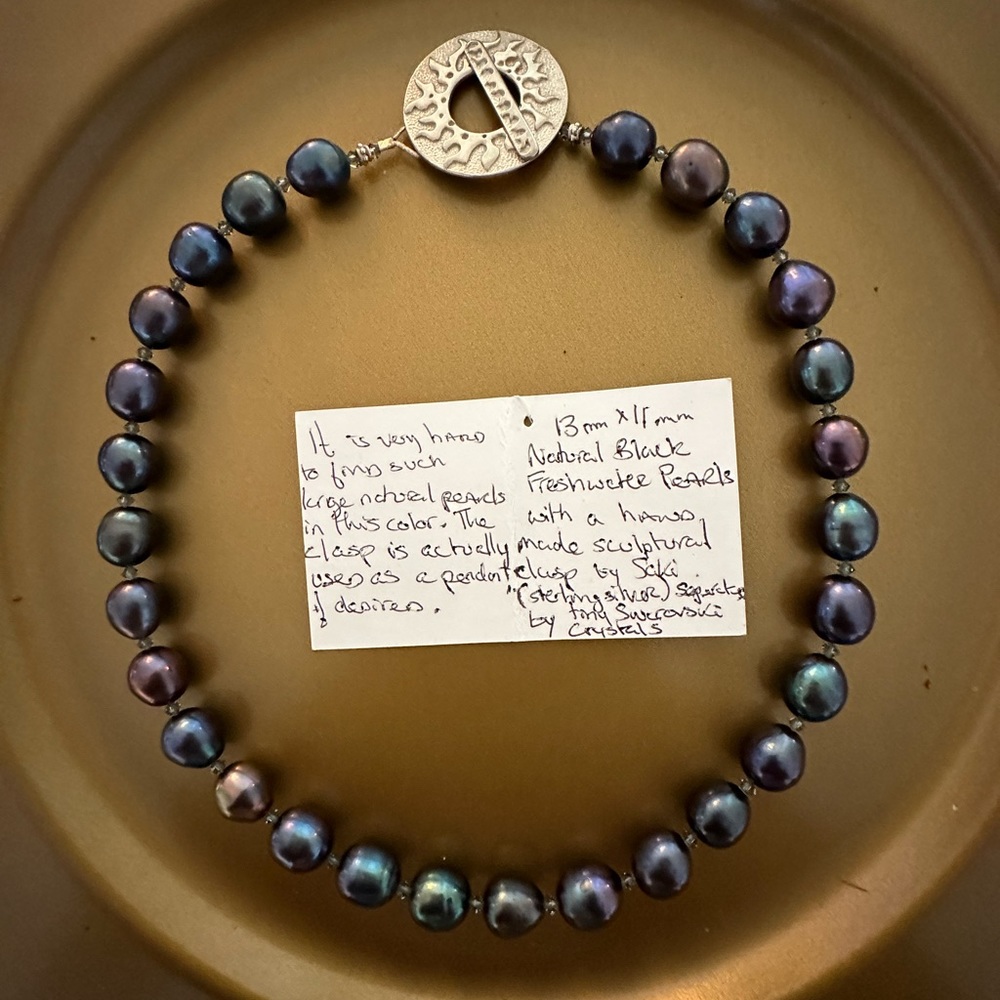 Vintage fresh water black pearls. Excellent condition.